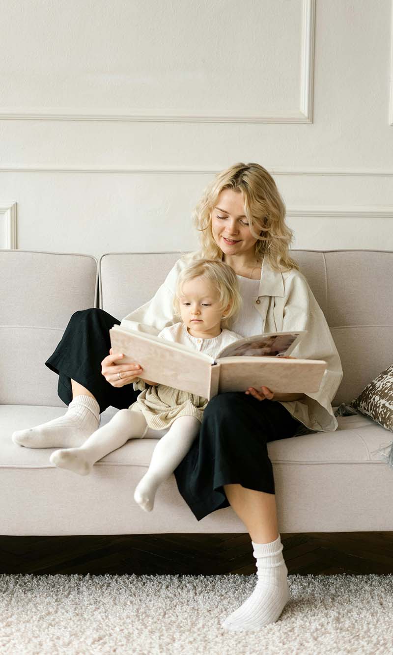 WOman reading to her daughter