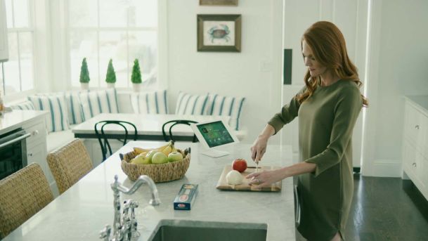 Woman chopping vegetables in the kitchen
